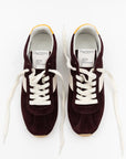 A pair of Essex Sneakers by ONCEPT, crafted from burgundy Italian suede with white laces, side panels, and yellow-accented heel tabs, are displayed side by side on a white background. The insoles are branded "ONCEPT.