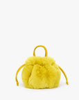 Bright yellow shearling Emma drawstring bag with top handle by Bungalow Furniture & Accessories.