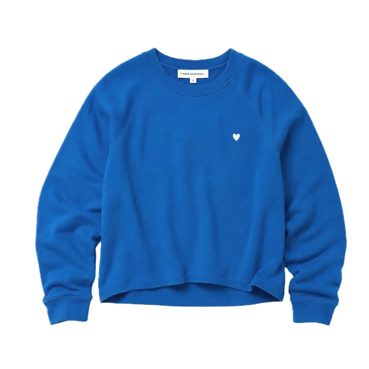 Bright blue sweatshirt with white heart, raglan sleeves, 100 cotton by Kerri Rosenthal for Bungalow Furniture & Accessories.