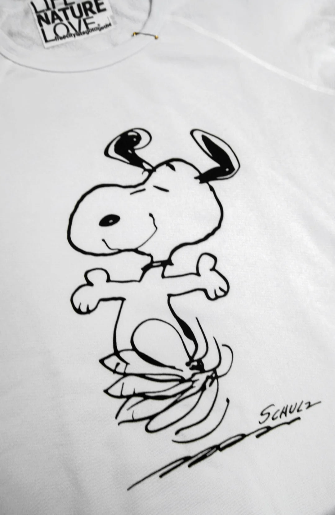 Oversized unisex sweatshirt with hand-screened Snoopy graphic and Schulz signature by Free City.