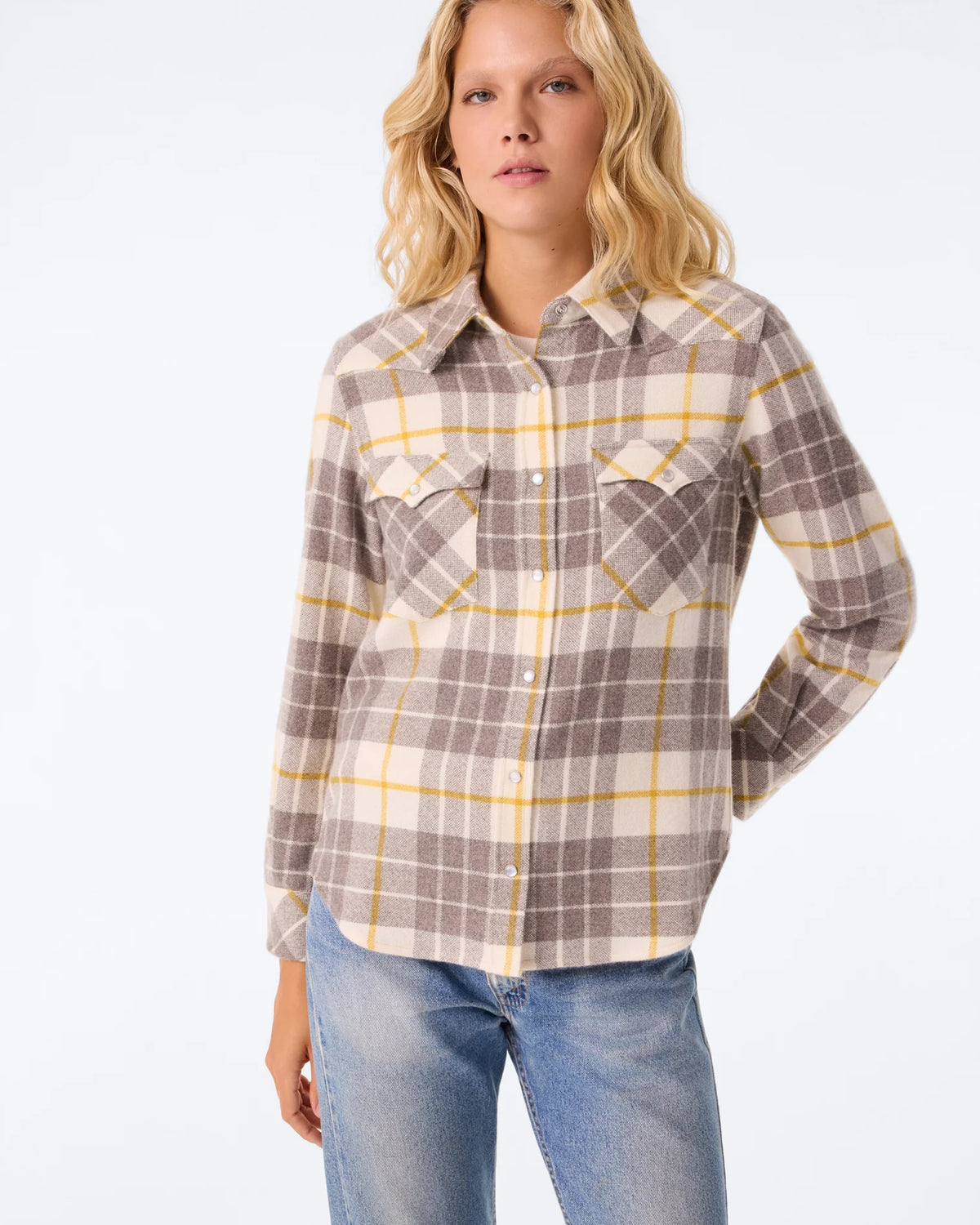 Beige, grey, and yellow plaid cashmere KUJTEN Lumber L/S Shirt with blue jeans against a plain background.