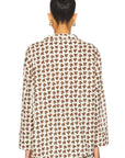 Back view of The Pajama Shirt by Bungalow Furniture & Accessories in cream cotton with a brown and orange geometric print.
