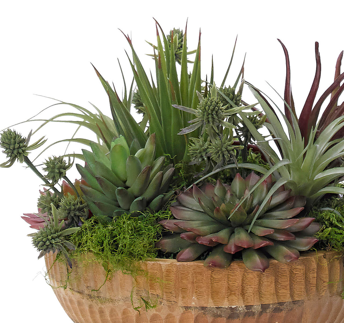 The Succulent Wood Bowl by Natural Decorations Inc. features green and purple succulents with moss in a wooden bowl, offering spiky and fleshy textures—an ideal, maintenance-free décor piece for any space.