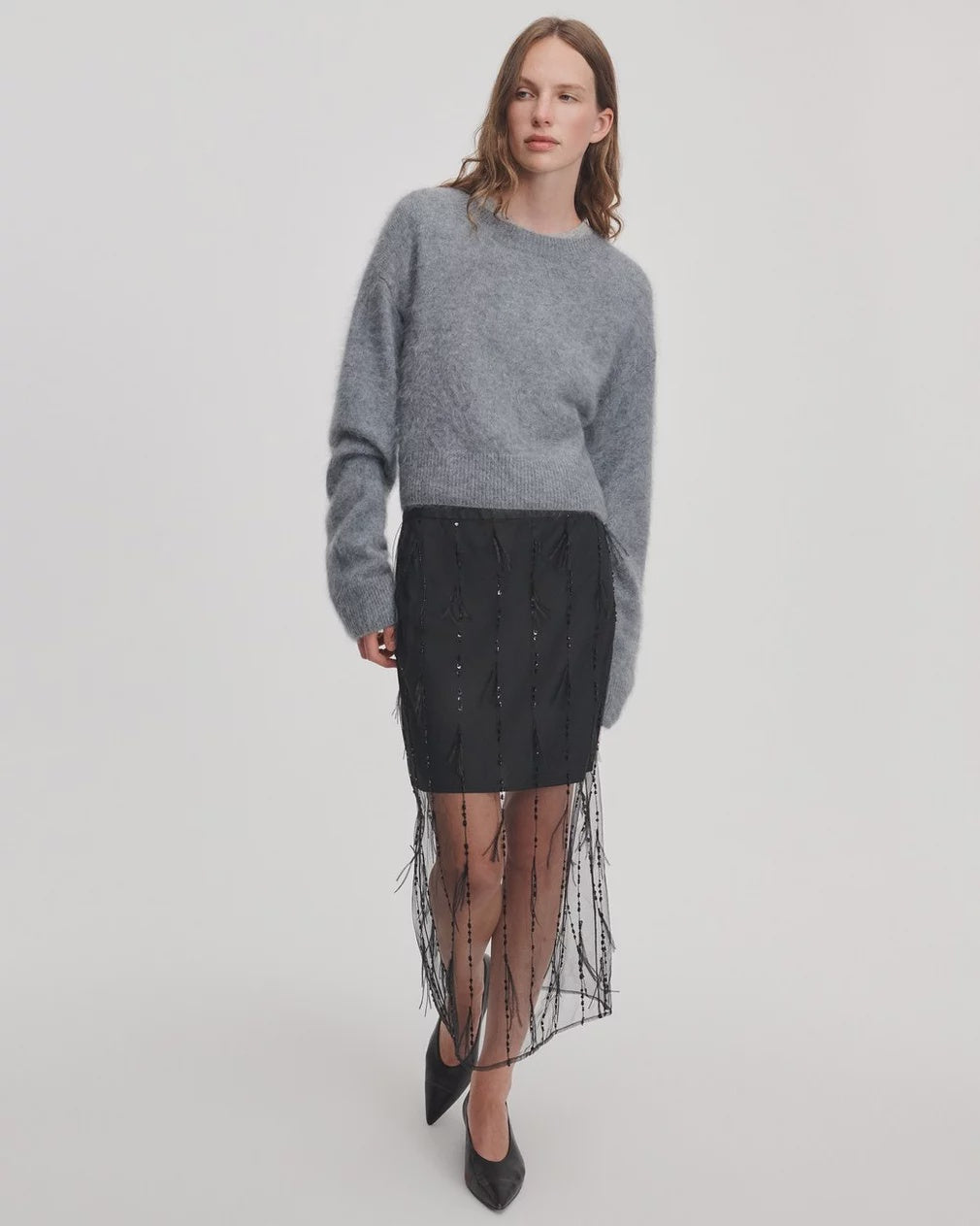 Rag &amp; Bone Geena skirt with sheer beaded overlay, paired with a fuzzy grey sweater and black pointed-toe shoes.