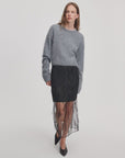Rag & Bone Geena skirt with sheer beaded overlay, paired with a fuzzy grey sweater and black pointed-toe shoes.