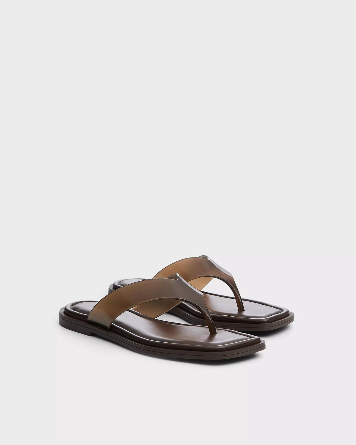 The Rag & Bone gracie jelly thong sandals in brown feature wide straps, a geometric square toe, and comfy OrthoLite foam insoles, shown against a plain white background.