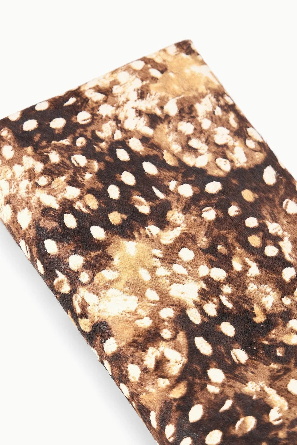 Folded haircalf clutch with brown, black, and tan animal print by Staud Muse, modern accessory for evening use.