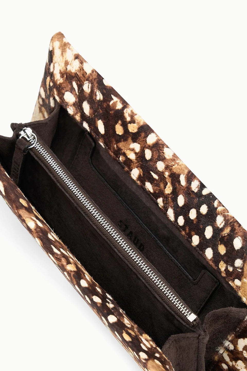 Brown Staud Muse Clutch with spotted pattern, silver zipper pocket, and dark lining for evening outings.