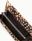 Brown Staud Muse Clutch with spotted pattern, silver zipper pocket, and dark lining for evening outings.