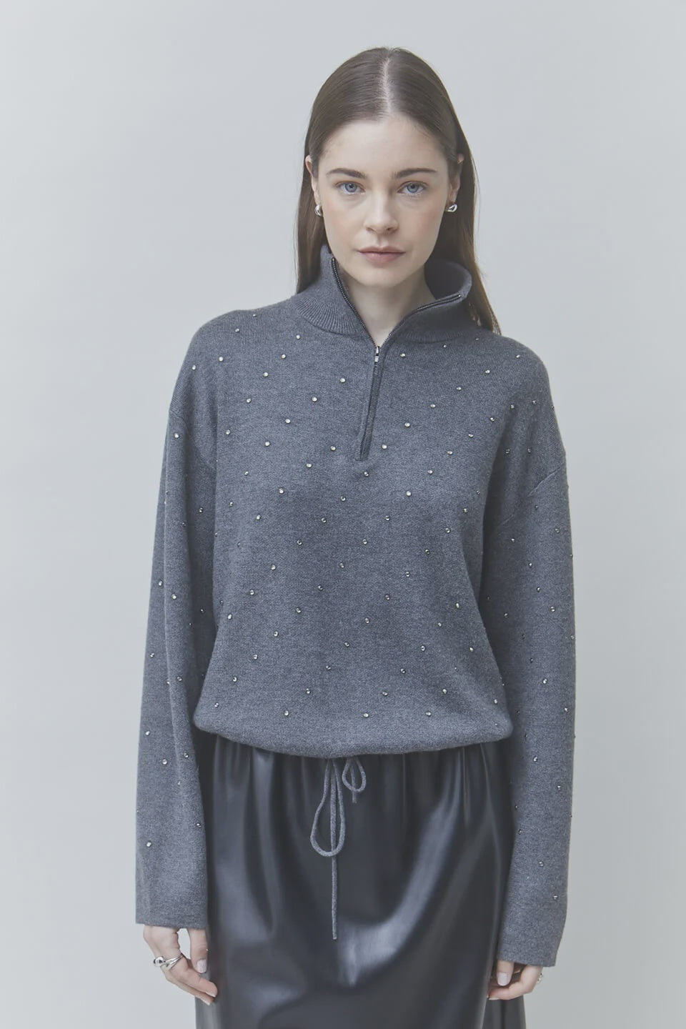 SUNCOO Pristo Knitted Rhinestone Sweater paired with a black skirt, styled against a light background.