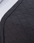 Dark grey POM POM Huntington King coverlet with diamond quilting on bed, white sheets, modern bedroom style.