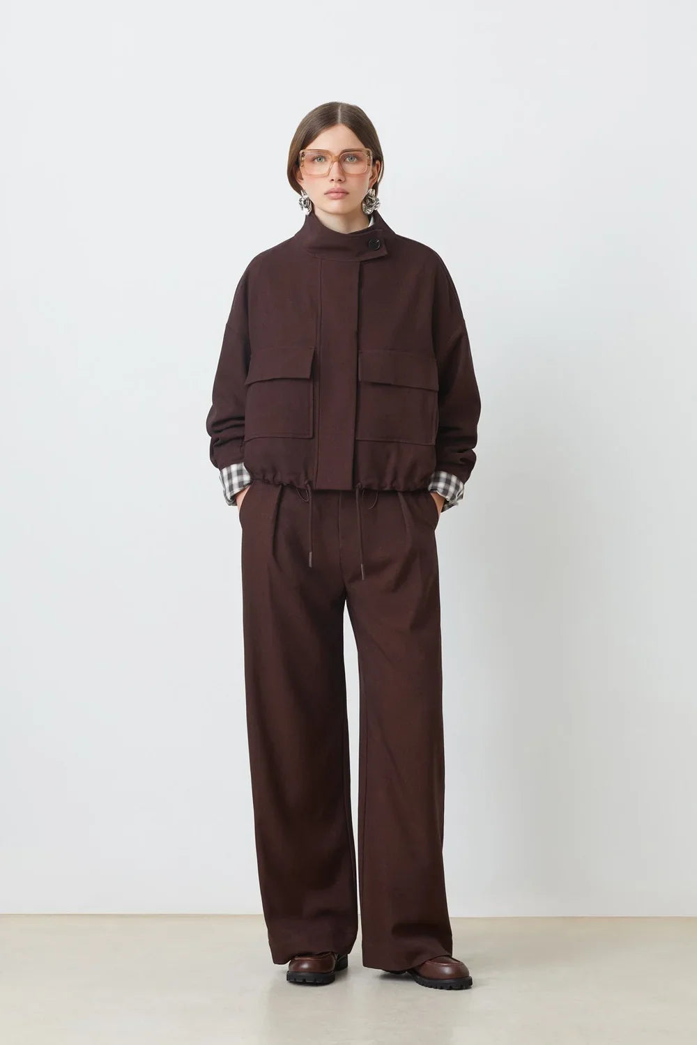 SUNCOO Dona chocolate brown jacket with plaid cuffs and wide-leg pants, modern style, white background.