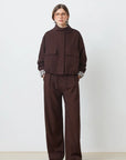 SUNCOO Dona chocolate brown jacket with plaid cuffs and wide-leg pants, modern style, white background.