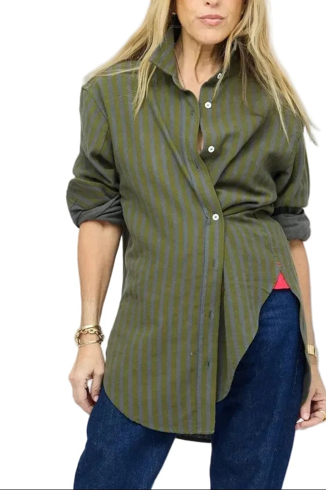 Kerri Rosenthal Jack Flannel Shirt in plaid with rolled sleeves, styled with blue jeans against a white backdrop.