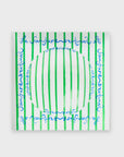 A Kerri Rosenthal 'Le Sunshine Stripe Decorative Bowl', featuring green vertical stripes and blue cursive text on a white ceramic base, is displayed against a plain white background. Its vibrant symmetry adds charm to any coffee table display.