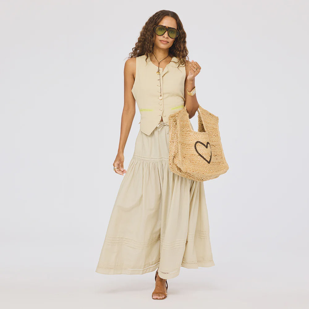Cream Kerri Rosenthal Vacance Pintuck Shirt styled with heart straw bag, sandals, and sunglasses for a chic look.