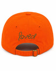Light pink baseball cap with green loved embroidery and adjustable strap, Kerri Rosenthal Imperfect Velvet Heart Hat.