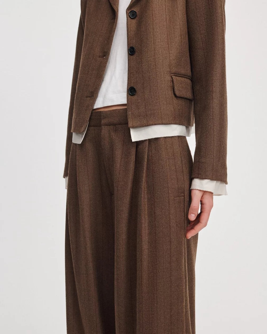 Lawrence tailored pant in brown herringbone from Rag &amp; Bone, styled with a matching blazer and white top.