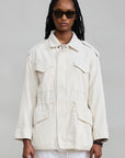 Off-white corduroy utility field jacket by Denimist with flap chest pockets and a drawstring waist.