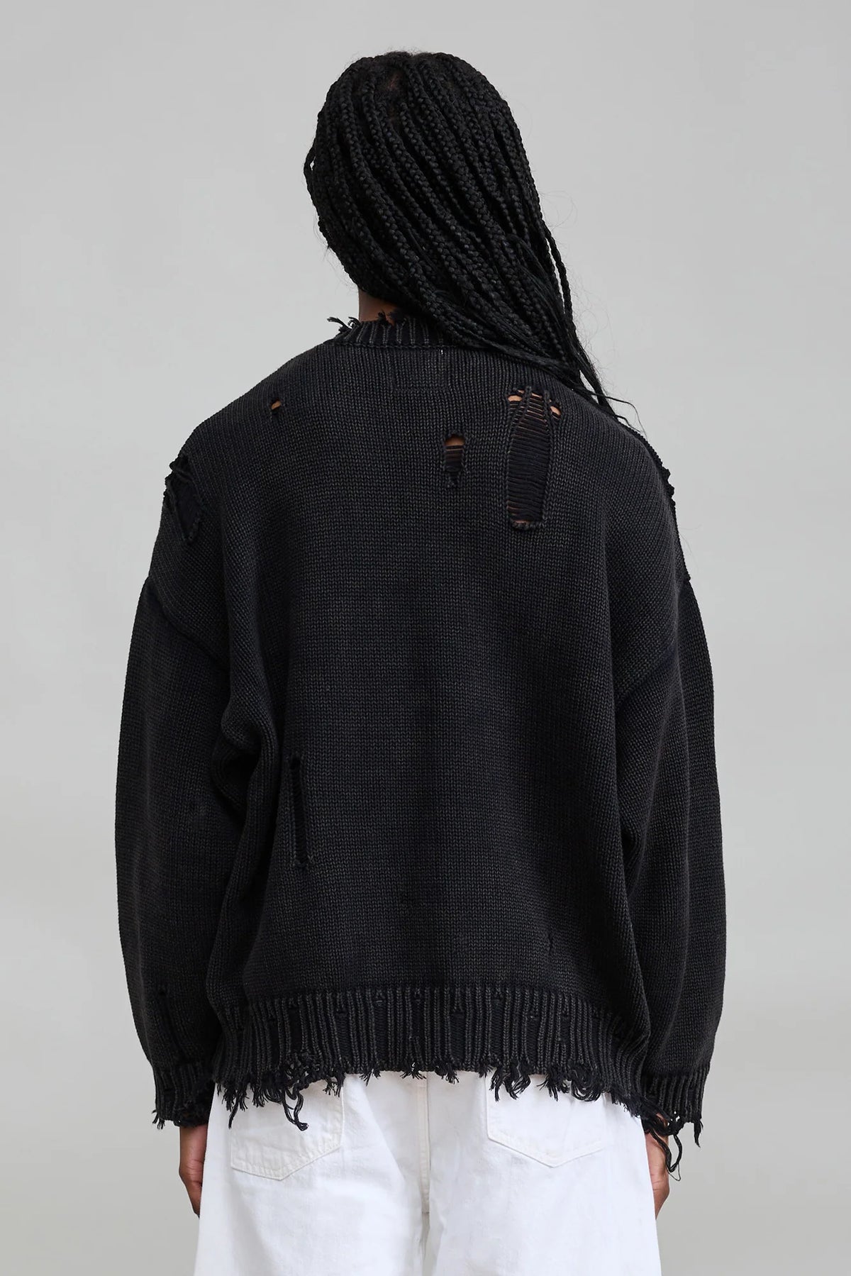 Distressed black American flag sweater by Denimist with long sleeves and a frayed hem.