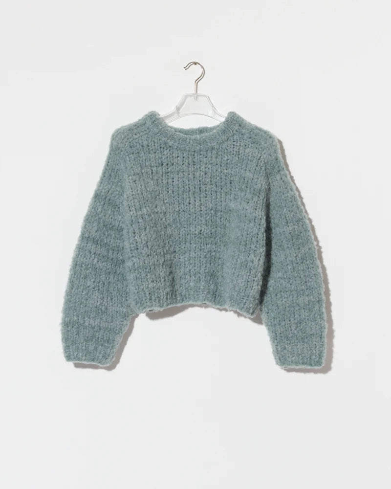 Chunky sage green wool alpaca mix cropped pullover sweater on a hanger.