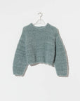Chunky sage green wool alpaca mix cropped pullover sweater on a hanger.