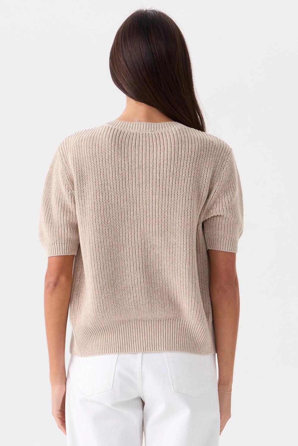 Rue Relaxed Cardigan in beige organic cotton short-sleeve knit, back view, paired with white pants.