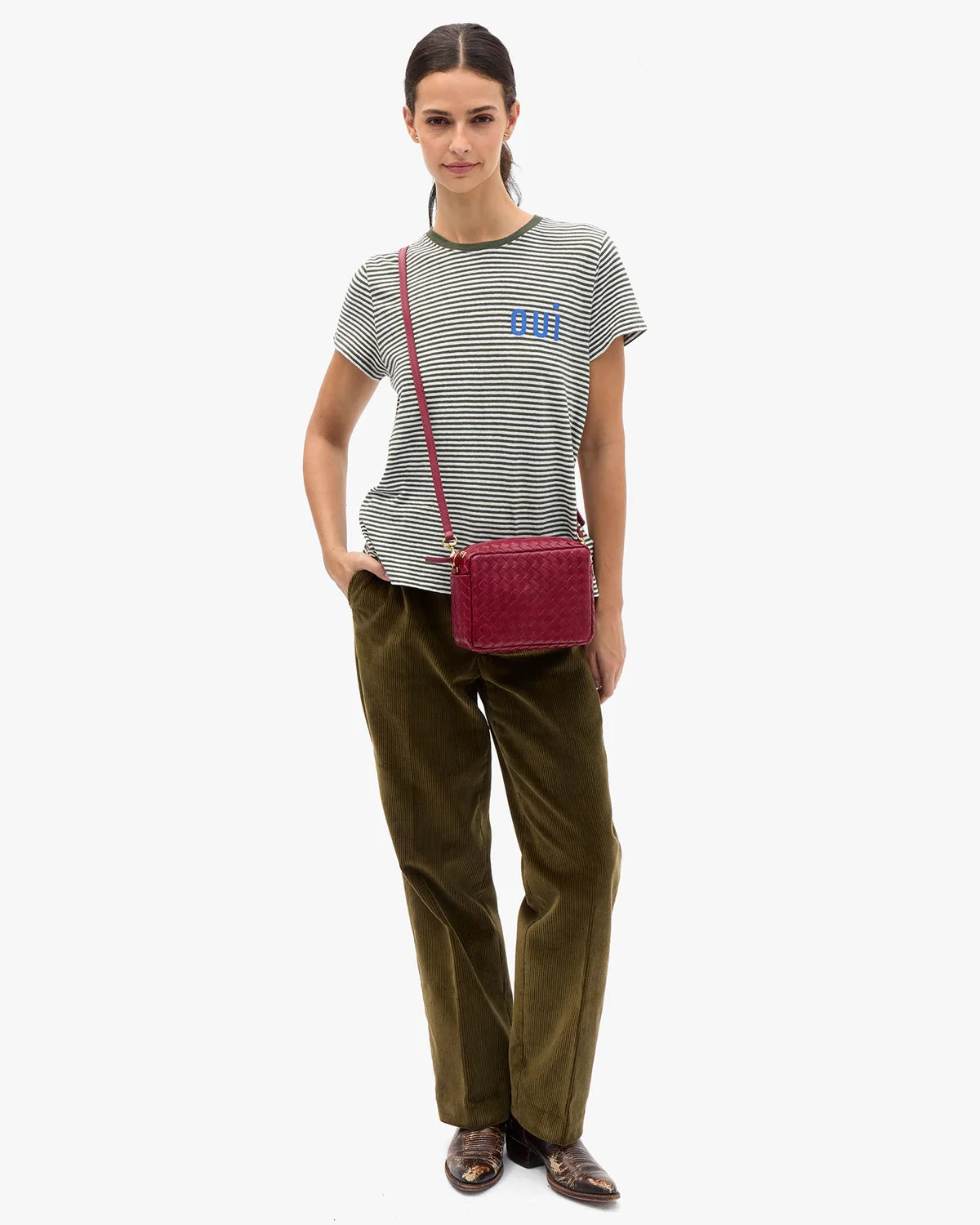 Clare Vivier Midi Sac 26 crossbody bag styled with a striped tee, olive pants, and brown shoes for a casual look.