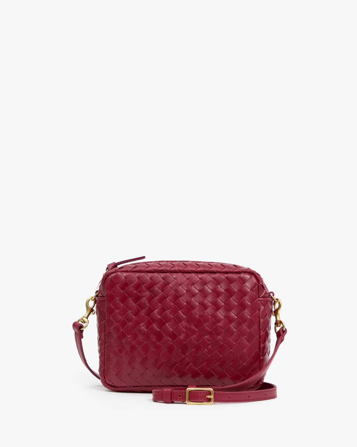 Small garnet handwoven leather crossbody bag with gold hardware and detachable strap by Clare Vivier.