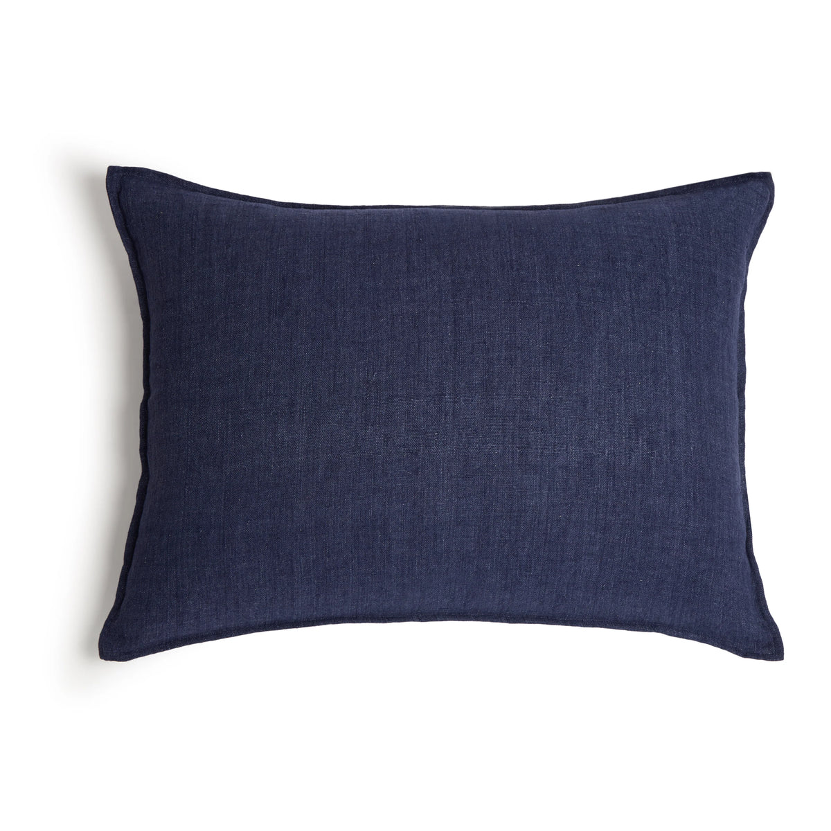 The Montauk Big Pillow 28x36 by POM POM is a rectangular, dark blue pillow made from heavyweight linen with a plain texture, shown against a white background.