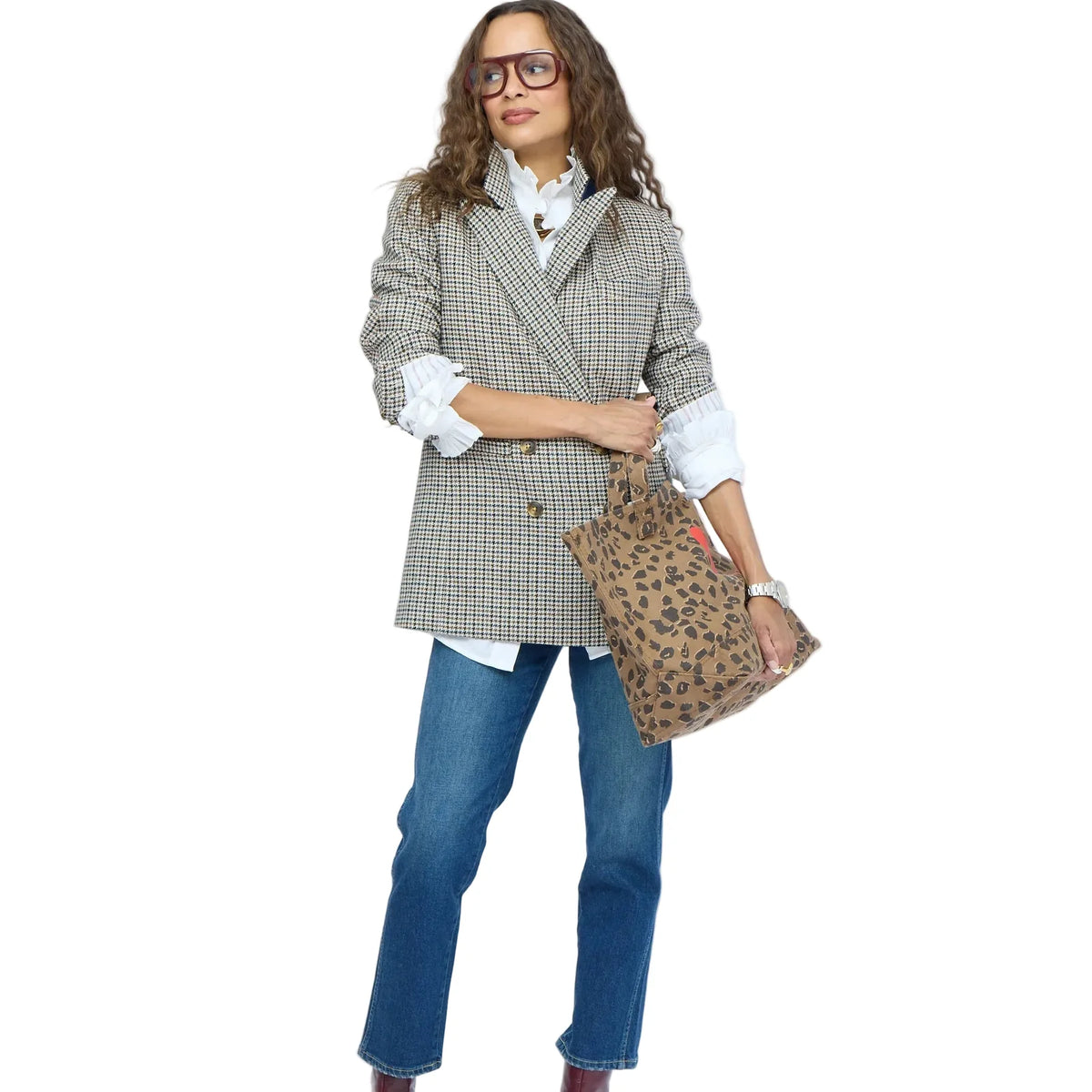 Kerri Rosenthal Nomad Tote carried by woman in plaid blazer and jeans for a modern, confident look.