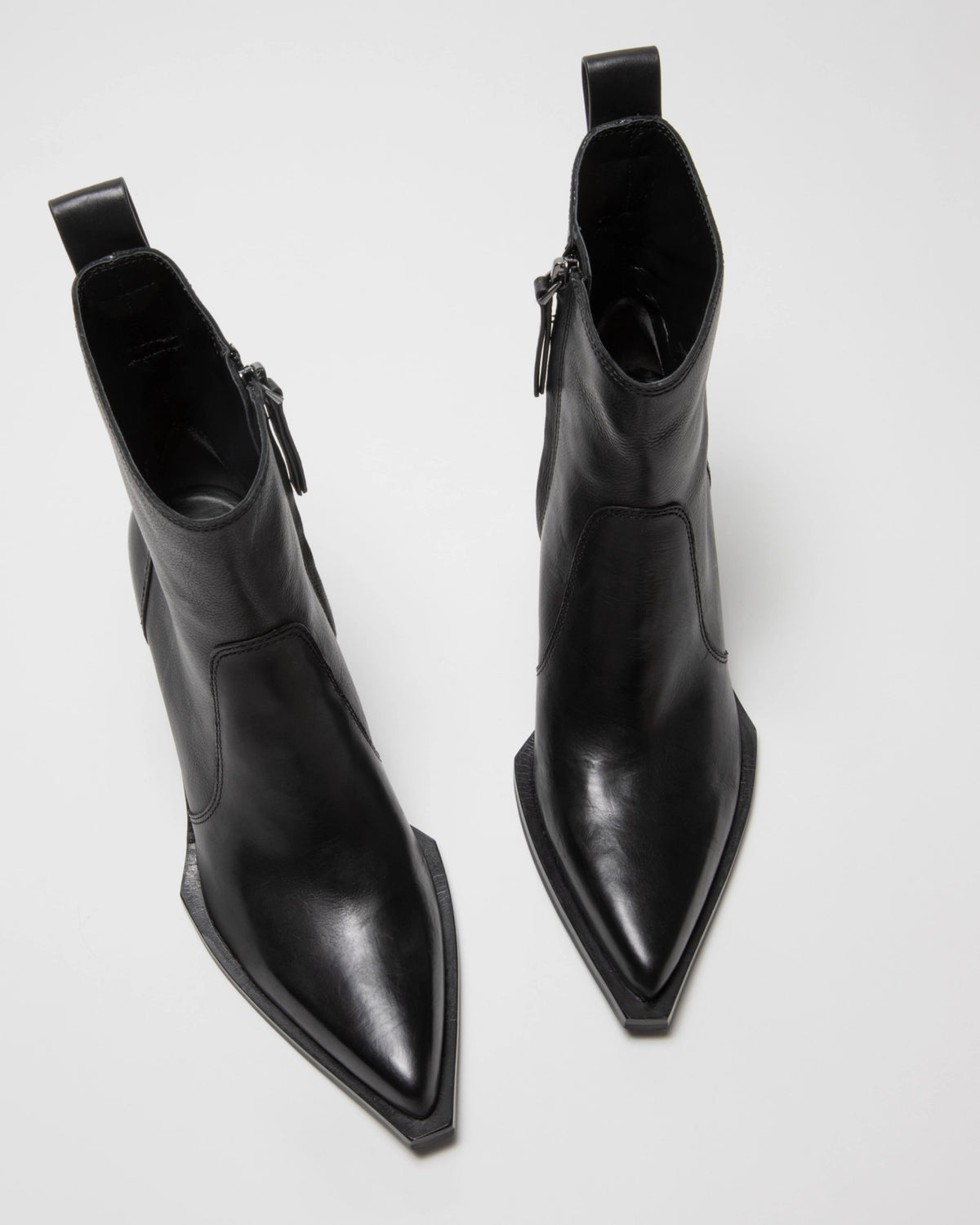 The ONCEPT Nashville Boot—black, genuine leather ankle boots with pointed toes, side zippers, and pull tabs—displayed on a light surface.