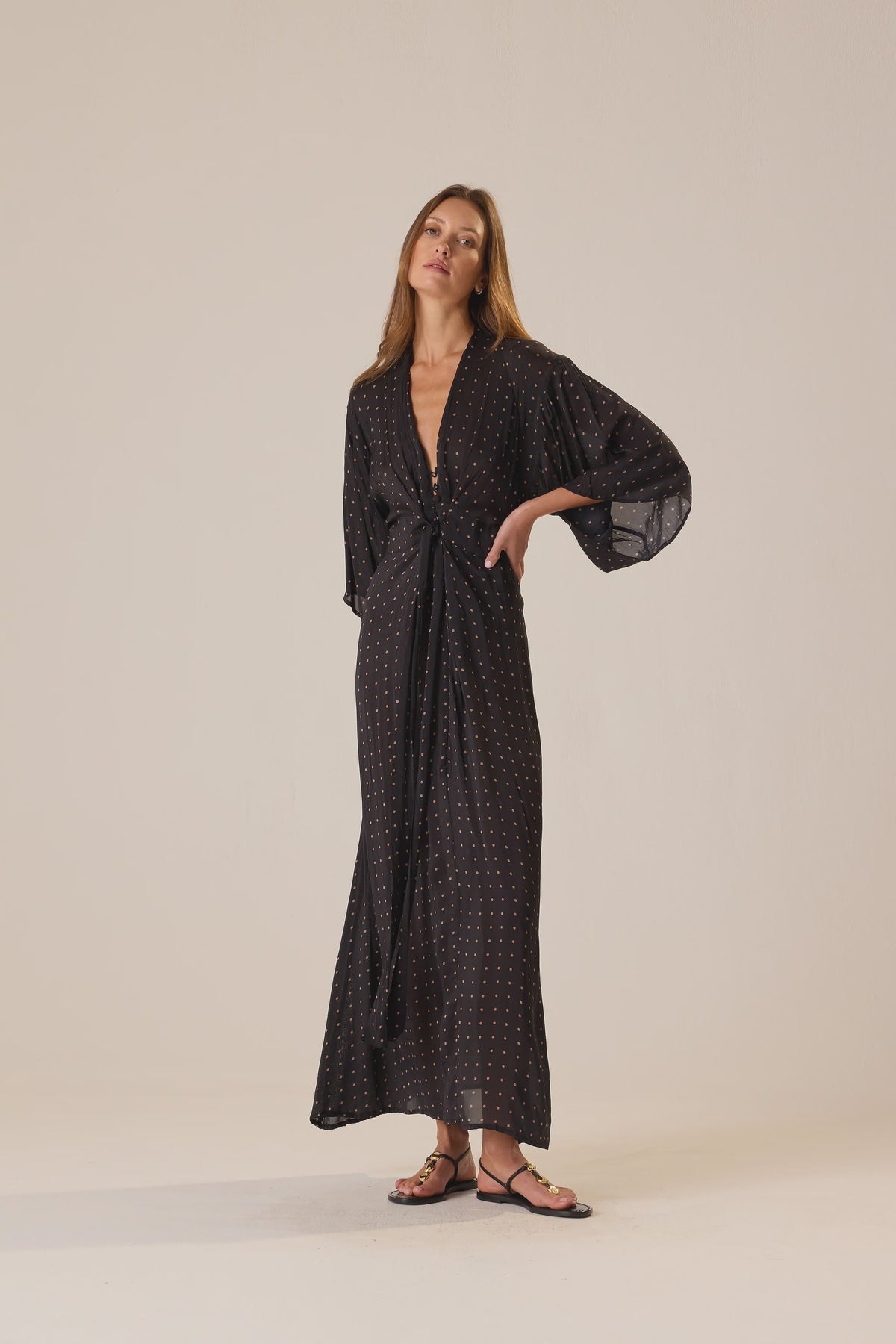 Natalie Martin Sarah Dress in a light setting, styled with sandals, at Bungalow Furniture & Accessories.