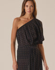 Black polka dot one-shoulder Erin Top by Natalie Martin, 70s-inspired style shown on model against plain background.
