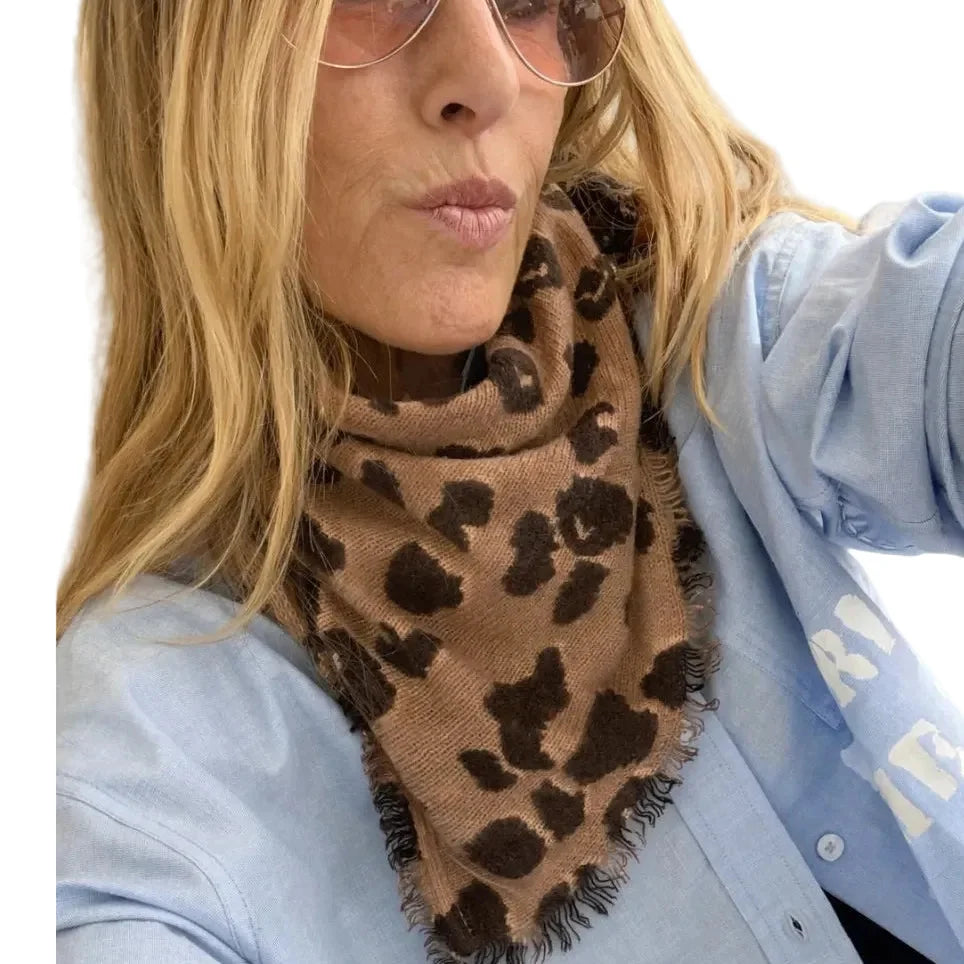 Kerri Rosenthal KR Cashmere Cheetah bandana in blue, styled with sunglasses and blue shirt for a chic look.
