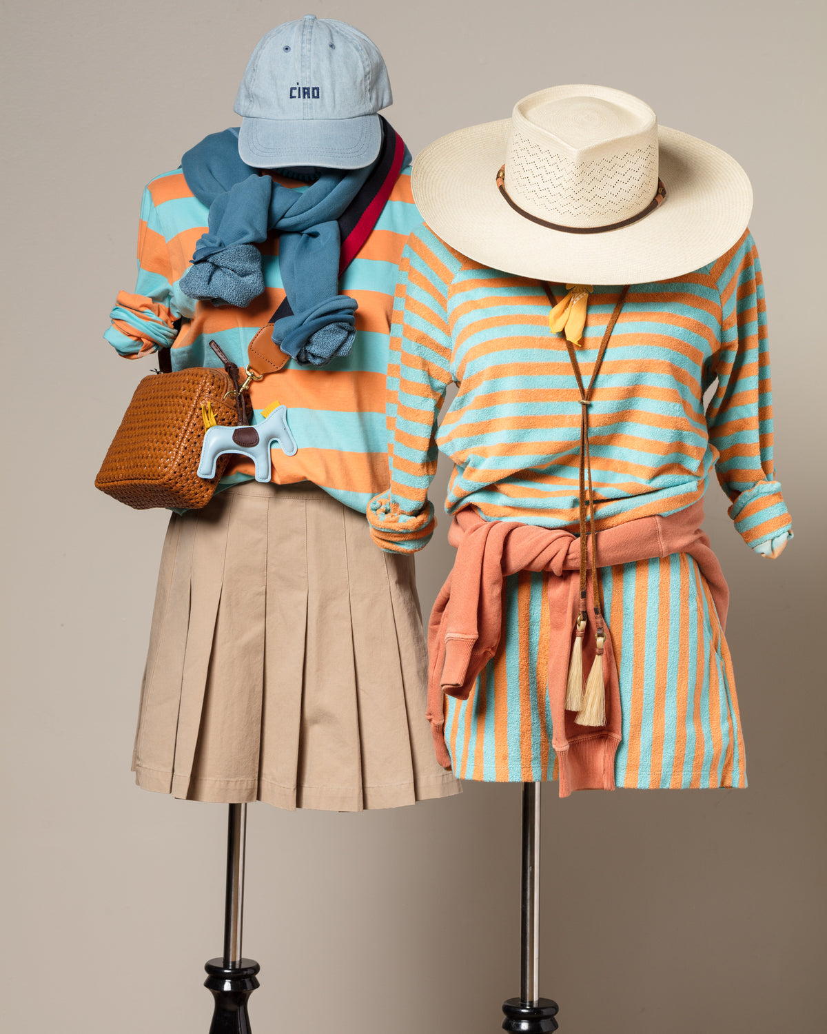 Striped orange and blue skirts and sweaters styled on mannequins, Bungalow Furniture & Accessories display.