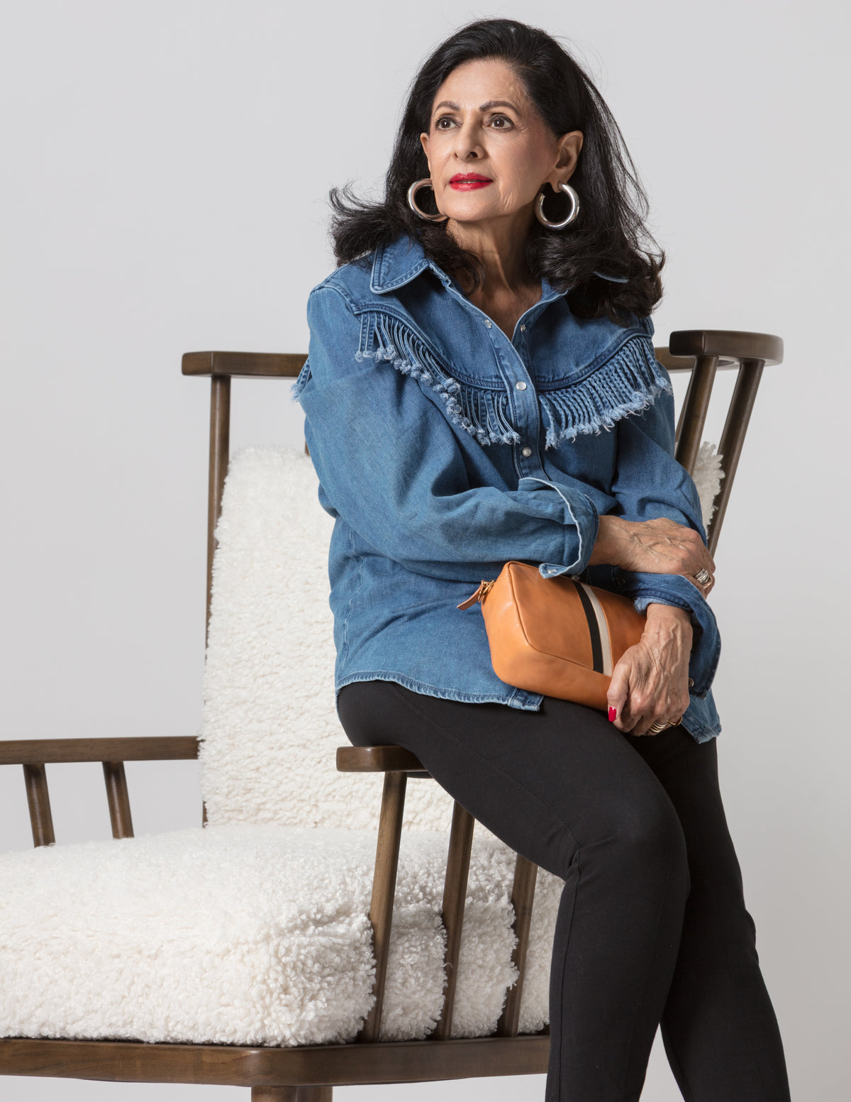 Tan purse with a chic look, styled by Bungalow Furniture & Accessories in a modern, relaxed setting.