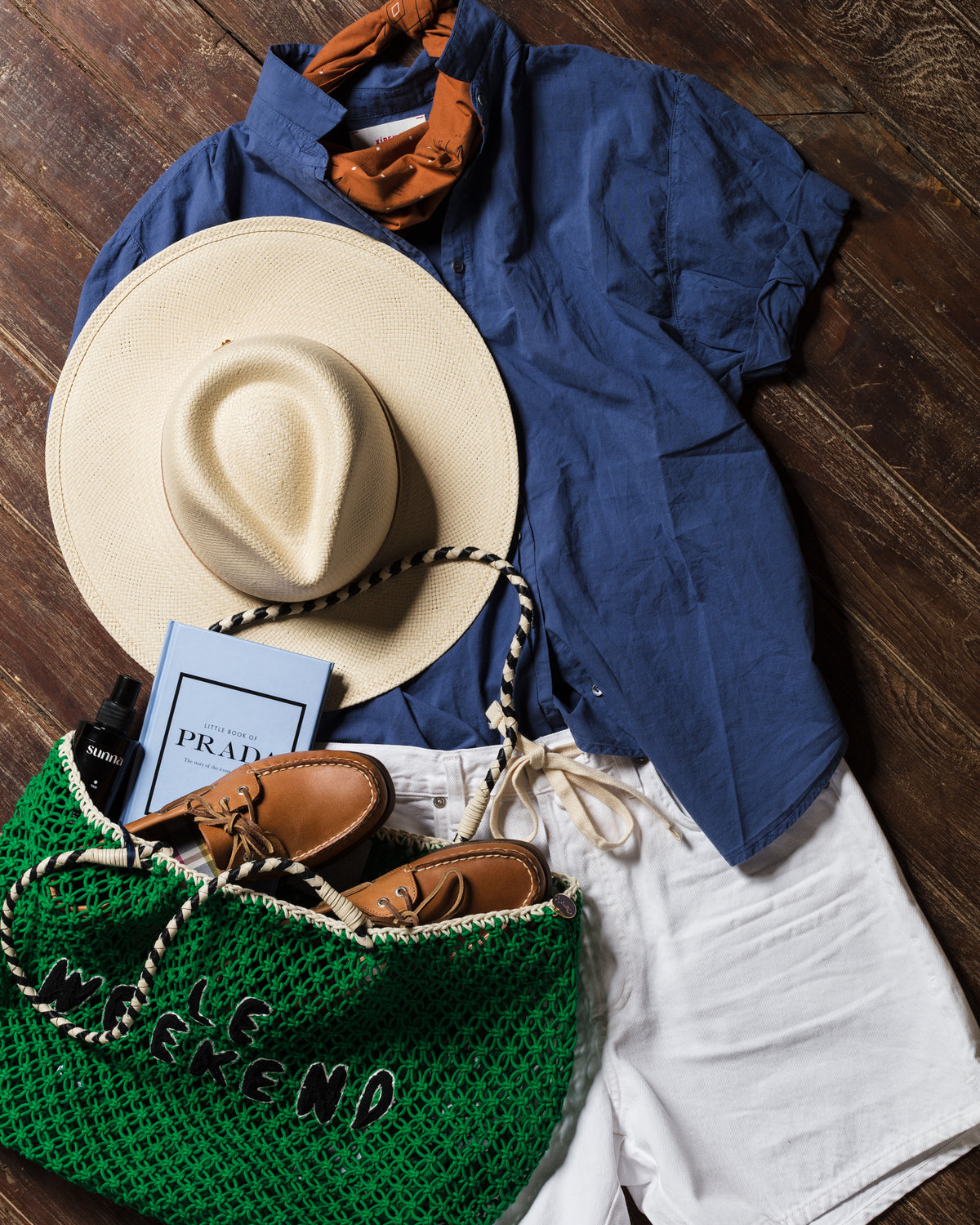Relaxed coastal outfit with green weekend bag, perfect for Bungalow Furniture & Accessories getaway essentials.