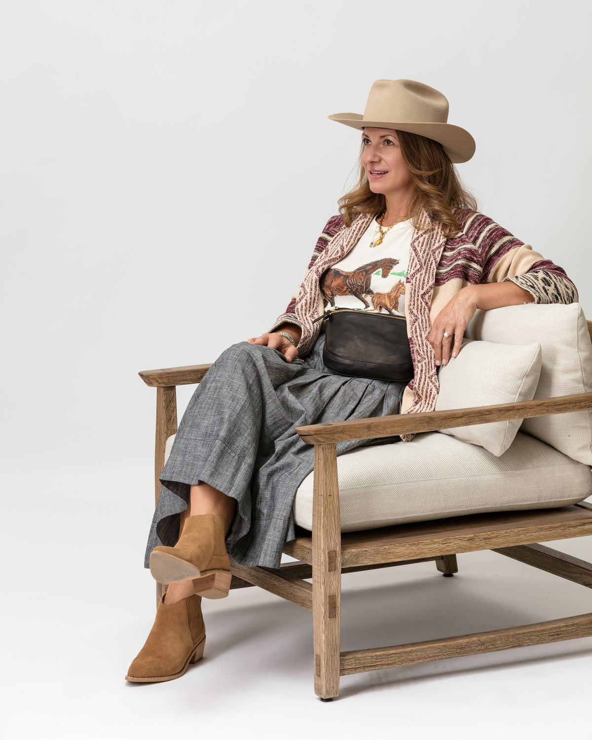 Patterned sweater with hat, styled for Bungalow Furniture & Accessories, on a wooden chair with a neutral backdrop.