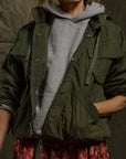 Grey Free City LifeNatureLove RTU Ziphood jacket styled with a floral skirt; casual, relaxed look for Bungalow Furniture.