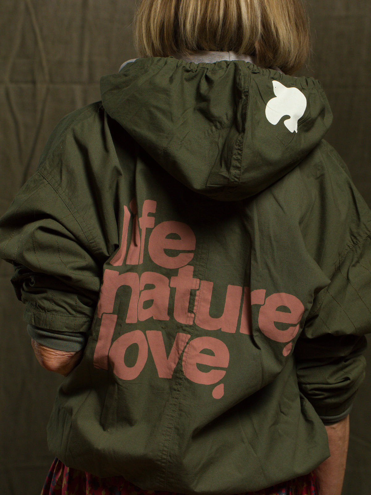 Free City LifeNatureLove RTU Ziphood Jacket in pink, back view, lifestyle styling for Bungalow Furniture & Accessories.