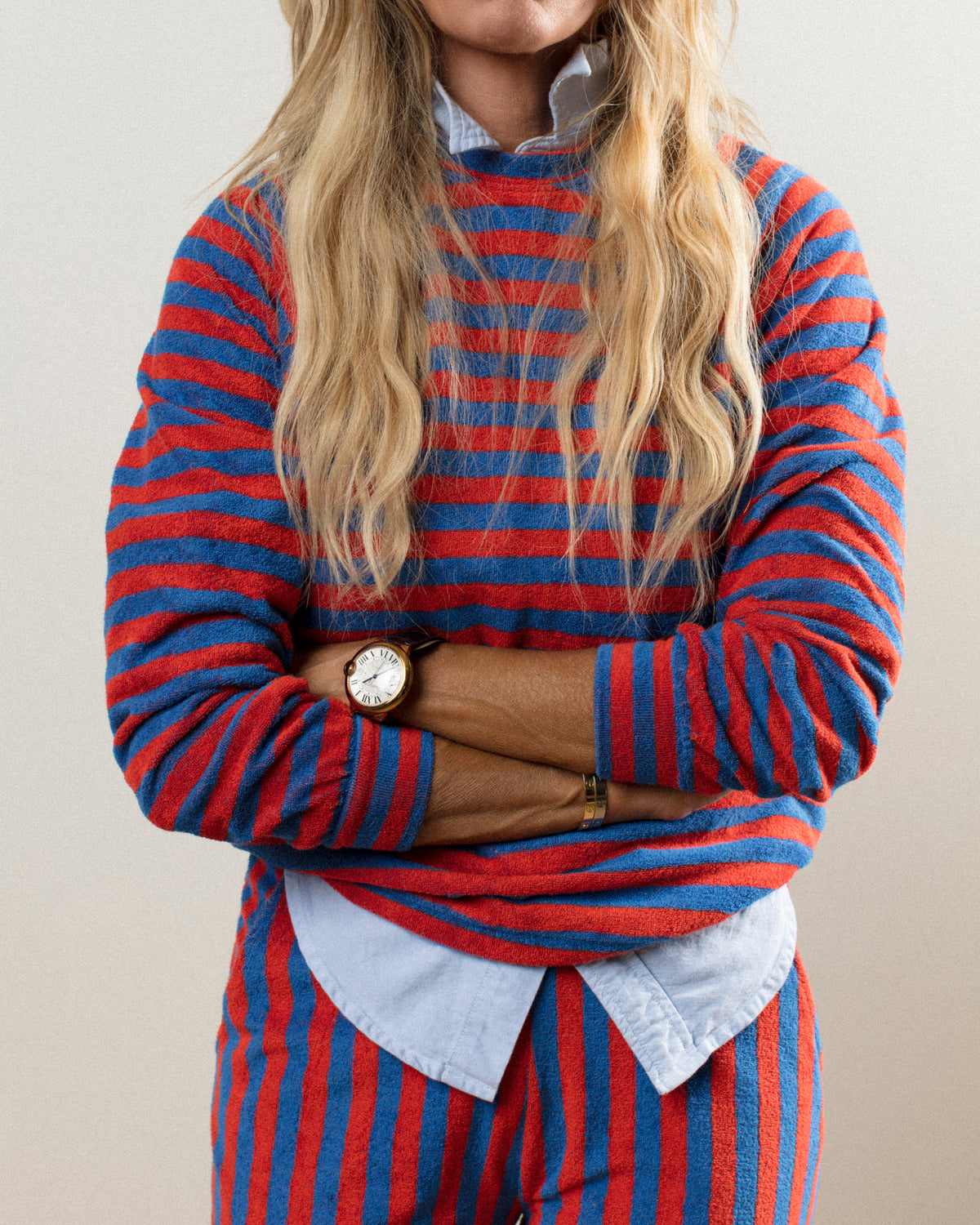 Red and blue striped outfit with long wavy hair, paired with a light blue shirt, Bungalow Furniture & Accessories style.