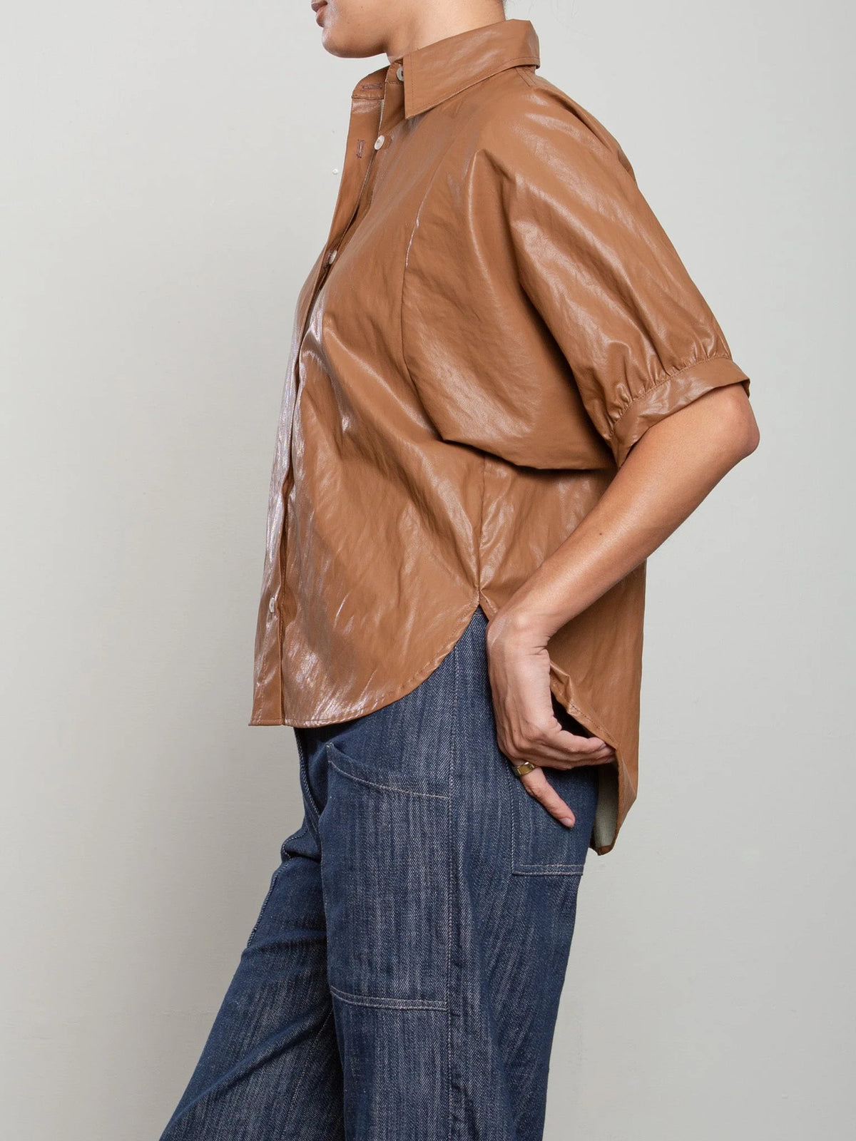 Pharaoh Claude brown button down shirt paired with blue jeans, casual style by Bungalow Furniture & Accessories.