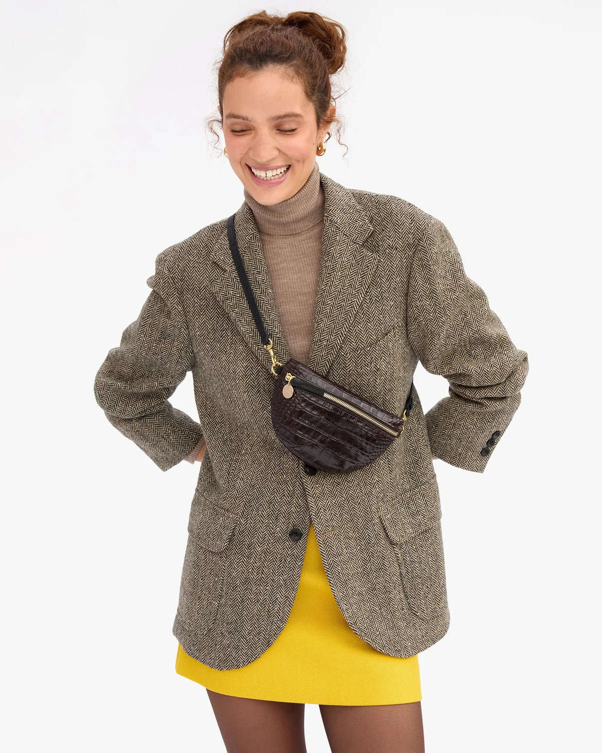 Clare Vivier Petite Fanny S26 bag styled with a brown blazer, tan turtleneck, and yellow skirt.