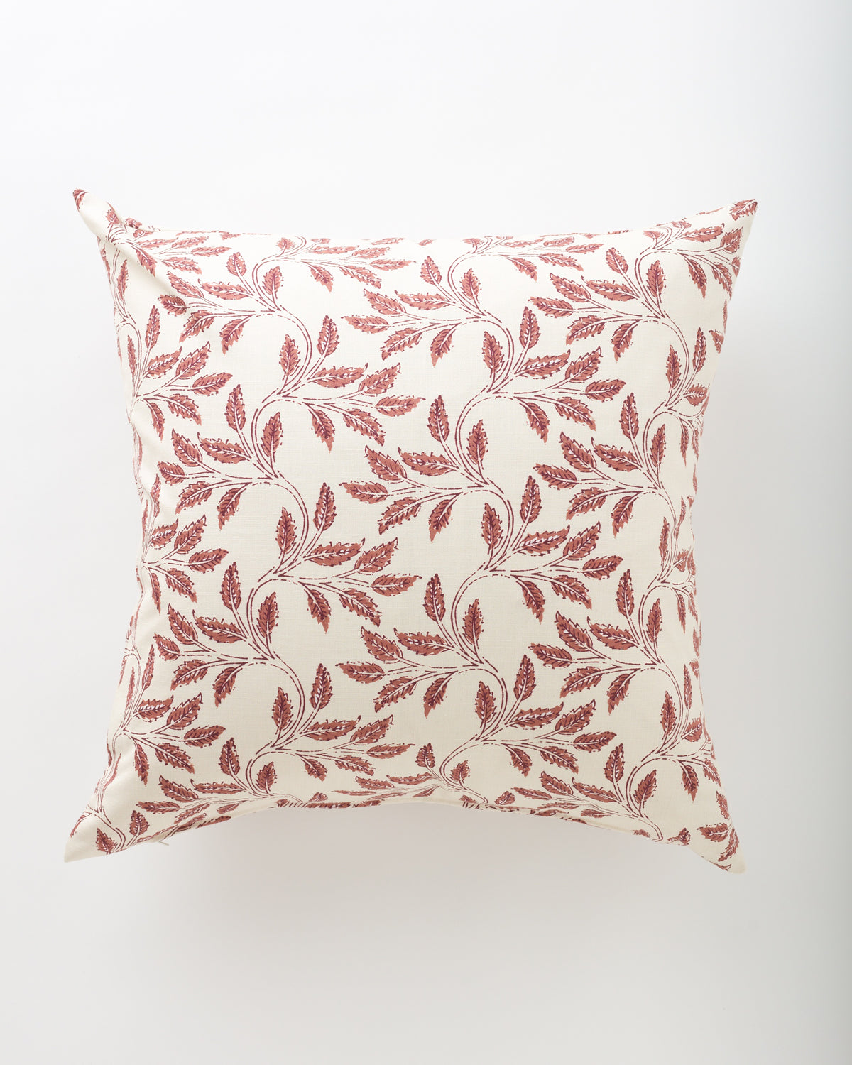 The Ajanta 26x26 euro pillow by Pindler features a cream background with a delicate, symmetrical red leafy branch pattern, creating an elegant and decorative look.