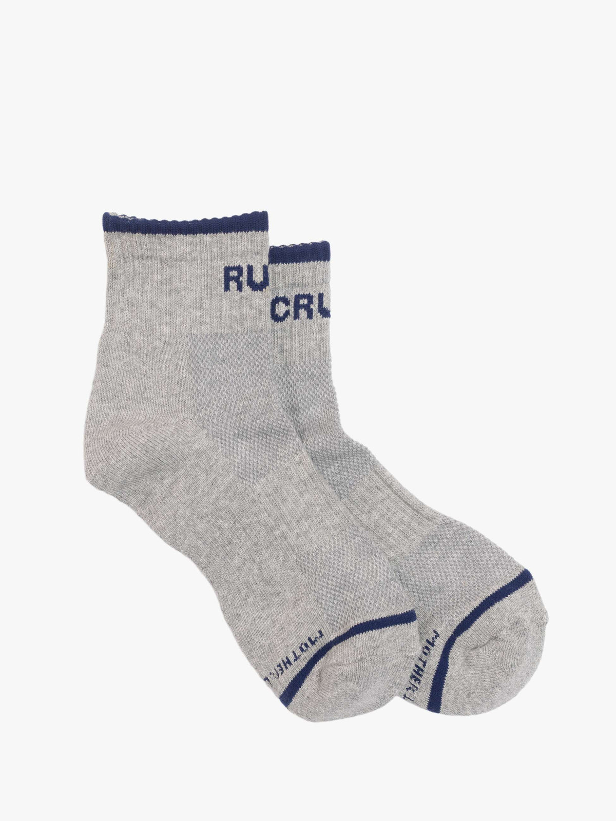 Baby Steps Ankle socks by Mother, in light gray with dark blue trim and blue "MOTHER" text on the cuffs and toes, shown on a plain white background.
