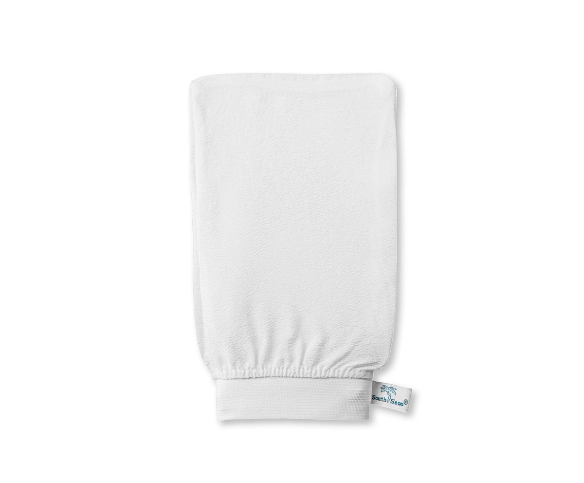 The South Seas Skincare Resurface Exfoliating Mitt is a white, rectangular mitt with an elasticated wrist band and a small fabric tag featuring blue text and logo—ideal for removing self tanner. Shown on a plain white background.