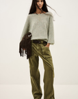 BA&SH Cardigan Isaac in cream with wide olive cargo pants and brown fringed bag, styled against a plain backdrop.