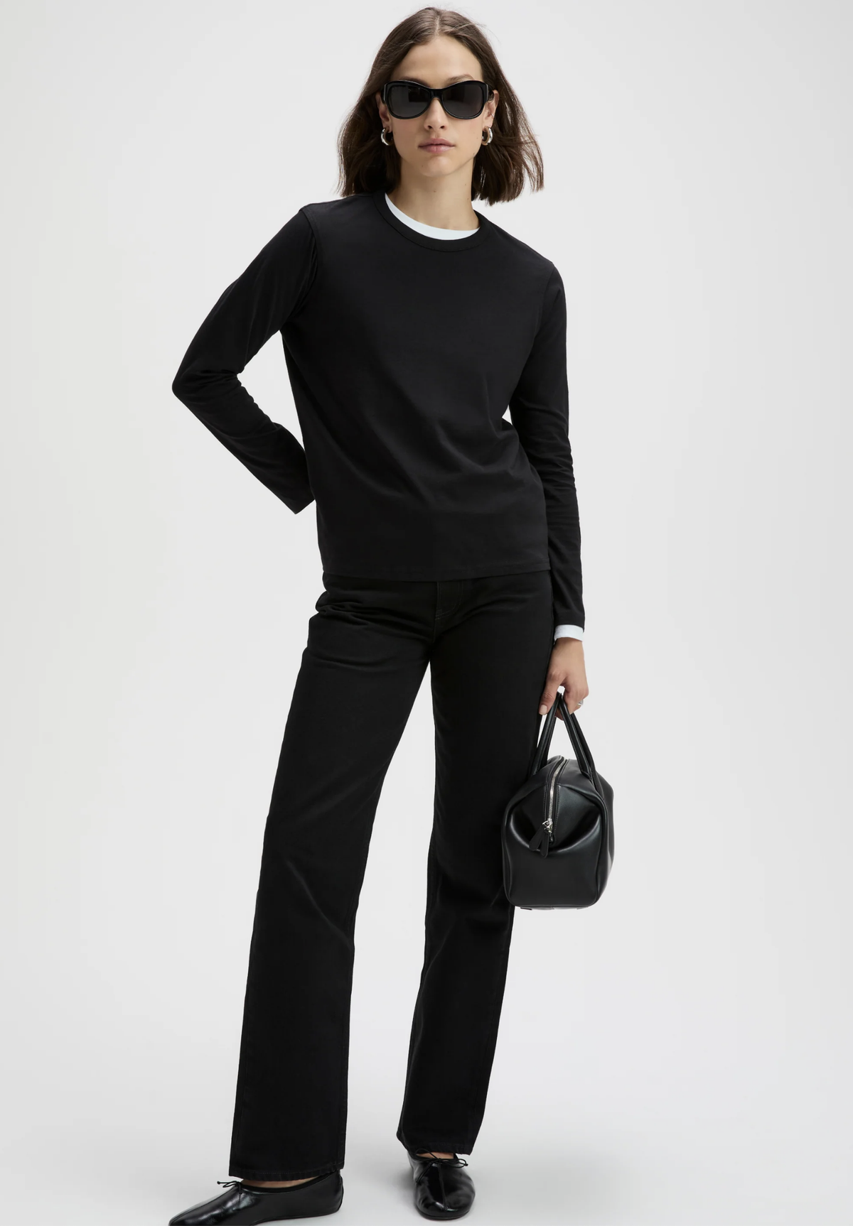 Sold Out NYC Long Sleeve Perfect Tee in black styled with sunglasses and accessories for a modern city look.