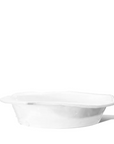 The Montes Doggett 5442-L Bowl No.442L is a handmade, high-fired white ceramic dish with a subtly scalloped edge, crafted in Peru and displayed against a plain white background.